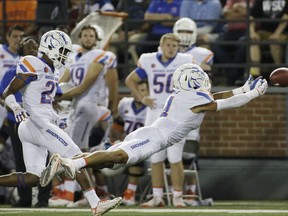 Boise State cornerback DeAndre Pierce (4) almost intercepts a pass in front of cornerback Reid Harrison-Ducros during the first half of an NCAA college football game against Washington State in Pullman, Wash., Saturday, Sept. 9, 2017. (AP Photo/Young Kwak)