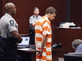 Matthew Phelps stands in the courtroom during his first appearance Tuesday, Sept. 5, 2017, in Raleigh, N.C. Phelps is charged in the death of his wife, Lauren Ashley-Nicole Phelps. Phelps dialed 911 early Sept. 1 saying says he took too much cold medicine, then woke with blood all over him and a knife on the bed he shared with his wife.
