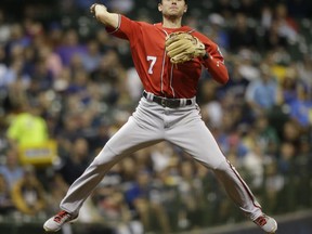 Washington Nationals' Trea Turner leaps to throw out Milwaukee Brewers' Eric Sogard during the first inning of a baseball game Saturday, Sept. 2, 2017, in Milwaukee. (AP Photo/Jeffrey Phelps)