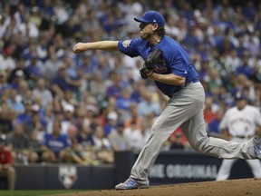 Chicago Cubs starting pitcher John Lackey throws during the first inning of a baseball game against the Milwaukee Brewers Friday, Sept. 22, 2017, in Milwaukee. (AP Photo/Morry Gash)