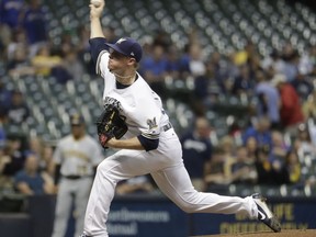 Milwaukee Brewers starting pitcher Chase Anderson throws during the first inning of a baseball game against the Pittsburgh Pirates Wednesday, Sept. 13, 2017, in Milwaukee. (AP Photo/Morry Gash)