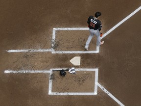 Miami Marlins' Christian Yelich walks away from home after striking out during the first inning of a baseball game against the Milwaukee Brewers Sunday, Sept. 17, 2017, in Milwaukee. (AP Photo/Morry Gash)