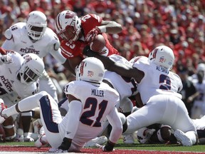 Wisconsin's Jonathan Taylor is stopped on a fourth down run during the first half of an NCAA college football game against Florida Atlantic Saturday, Sept. 9, 2017, in Madison, Wis. (AP Photo/Morry Gash)