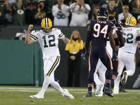 Green Bay Packers' Aaron Rodgers celebrates a touchdown pass during the first half of an NFL football game against the Chicago Bears Thursday, Sept. 28, 2017, in Green Bay, Wis. (AP Photo/Matt Ludtke)