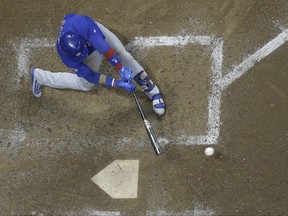 Chicago Cubs' Javier Baez hits an RBI single during the ninth inning of a baseball game against the Milwaukee Brewers Thursday, Sept. 21, 2017, in Milwaukee. (AP Photo/Morry Gash)