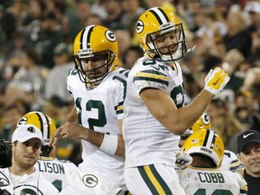 Green Bay Packers' Jordy Nelson (87) celebrates his touchdown catch with Aaron Rodgers (12) during the second half of an NFL football game against the Chicago Bears Thursday, Sept. 28, 2017, in Green Bay, Wis. (AP Photo/Mike Roemer)