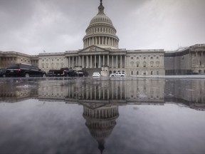 In this July 28, 2017 photo, the Capitol is seen during a heavy rain in Washington. Harvey has scrambled the equation for Congress as lawmakers return to Washington Tuesday. Having accomplished little in the first six months of the year they now face a daunting workload, but the immediate need to send aid to help Texas and Louisiana recover from the massive storm damage takes center stage, and pushes other disputes to the side.  (AP Photo/J. Scott Applewhite)