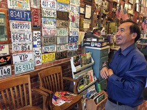 In this Sept. 6, 2017, photo, Anthony Pham, talks in his Monroe, Ga., barber shop. He became a U.S citizen in 1987, five years after he immigrated from Vietnam.   Now a business owner and proud Republican in Georgia's staunchly conservative 10th Congressional District, Pham says he supports maintaining legal status for immigrants who arrived in the country illegally as children, the so-called "Dreamers" brought by adult family members.  (AP Photo/Bill Barrow)