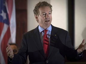 In this Aug. 11, 2017 photo, Sen. Rand Paul, R-Ky., speaks to supporters in Hebron, Ky.  The Senate has rejected a bipartisan push for a new war authorization against the Islamic State and other terrorist groups. Senators have decided to let the White House continue using a 16-year-old law as the basis for sending American troops into combat. Senators have voted to scuttle an amendment to the annual defense policy crafted by Sen. Rand Paul that would have allowed the war authorizations created in the wake of the Sept. 11 attacks to lapse after six months.   (AP Photo/Bryan Woolston)