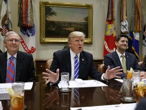 FILE - In this March 1, 2017, file photo President Donald Trump, flanked by Senate Majority Leader Mitch McConnell of Ky., left, and House Speaker Paul Ryan of Wis., speaks in the Roosevelt Room of the White House in Washington.  After a summer of staff shake-ups and self-made crises, President Donald Trump is emerging politically damaged, personally agitated and continuing to buck at the confines of his office, according to some of his close allies. (AP Photo/Evan Vucci, File)