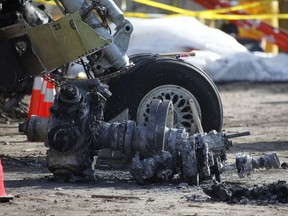 FILE - In this Feb. 16, 2009, file photo, debris at the scene of a plane crash site of Continental Connection Flight 3407 in Clarence Center, N.Y. An influential industry panel plans to vote Sept. 14, 2017, on recommendations that the Federal Aviation Administration eliminate or scale back dozens of safety rules, including one on airline pilot qualifications. The recommendations are contained in a report to the FAA's Aviation Rulemaking Advisory Committee in response to President Donald Trump's directives to cut government regulations. (AP Photo/David Duprey, pool)