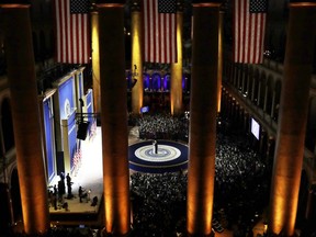 FILE - In this Jan. 20, 2017, photo, President Donald Trump dances with first lady Melania Trump during the Salute to Armed Forces Ball at the National Building Museum in Washington. When President Donald Trump's inaugural committee raised an unprecedented $107 million for a ceremony that officials promised would be "workmanlike," the committee pledged to give leftover funds to charity. Nearly eight months later, the group has helped pay for redecorating at the White House and the vice president's residence in Washington. But nothing has gone to charity. (AP Photo/David J. Phillip, File)