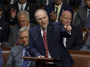 This image from House Television shows House Republican Whip Steve Scalise speaking on the House floor of the Capitol in Washington, Thursday, Sept. 28, 2017.  To hugs and a roaring bipartisan standing ovation, Scalise returned to the House on Thursday, more than three months after a baseball practice shooting left him fighting for his life. (House Television via AP)