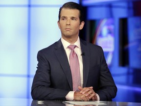 FILE - In this July 11, 2017, file photo, Donald Trump Jr. is interviewed by host Sean Hannity on the Fox News Channel television program, in New York. The Republican National Committee has spent nearly $200,000 on legal fees for President Donald Trump's eldest son in connection with the Russia investigation. An RNC official says about $167,000 was paid to Donald Trump Jr.'s attorney, Alan Futerfas. Another $30,000 went to the law firm of Williams & Jenson, which helped prepare him for testimony. The official insisted on anonymity to discuss financial information not yet made public.(AP Photo/Richard Drew, File)