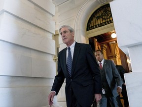 In this June 21, 2017 photo, Special Counsel Robert Mueller departs Capitol Hill following a closed door meeting in Washington. Mueller's team of investigators is in possession of a letter drafted by President Donald Trump and an aide, but never sent, that lays out a rationale for firing FBI Director James Comey, according to a person familiar with the investigation.  (AP Photo/Andrew Harnik)