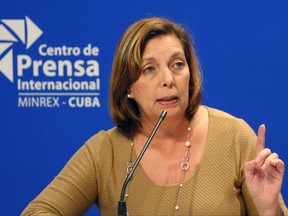FILE - In this Jan. 12, 2017, file photo,Josefina Vidal speaks to reporters in Havana, Cuba. The Trump administration will press its concerns about unexplained incidents harming American diplomats in Cuba during a meeting in Washington, as the United States considers shuttering its recently re-opened Embassy in Havana. U.S. diplomats will host Cuban official Josefina Vidal, who has been the public face of Cuba's diplomatic opening with the U.S., and other Cuban officials, a State Department official said. (AP Photo/Desmond Boylan, File)