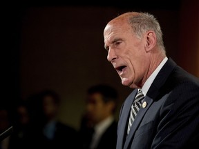 FILE - In this Aug. 4, 2017, file photo, Director of National Intelligence Dan Coats speaks during a news conference at the Justice Department in Washington.  The Trump administration is urging Congress to reauthorize an intelligence surveillance law set to expire at the end of the year. Attorney General Jeff Sessions and Coats wrote a letter Sept. 11, 2017, to top Republicans and Democrats in Congress, asking them to not only reauthorize it as it's written, but make it a permanent fixture in the law books. (AP Andrew Harnik, File)