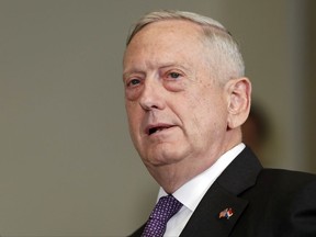 FILE - In this Aug. 15, 2017, file photo, Defense Secretary Jim Mattis speaks at the Pentagon. New guidance released by the Pentagon on Sept. 15, makes it clear that any transgender troops currently in the military can re-enlist in the next several months, even as the department debates how broadly to enforce a ban on their service ordered by President Donald Trump. (AP Photo/Alex Brandon, File)