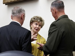 FILE - In this June 12, 2017, file photo, Defense Secretary Jim Mattis, from left, Delegate Madeleine Bordallo, D-Guam, and Joint Chiefs Chairman Gen. Joseph Dunford, talk before a House Armed Services Committee on Capitol Hill in Washington. The House Ethics Committee said Sept. 11, it will continue a review of Bordallo who potentially profited from a foreign government through the rental of a home. In its announcement, the committee also released recommendations from the Office of Congressional Ethics which found "substantial reason to believe" Bordallo rented the home in Guam to the Japanese Consulate. (AP Photo/Alex Brandon, File)