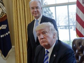 FILE - In this March 24, 2017 file photo, President Donald Trump with Health and Human Services Secretary Tom Price are seen in the Oval Office of the White House in Washington. Price resigned Sept. 29, after his costly travel triggered investigations that overshadowed the administration's agenda and angered his boss. Price's regrets and partial repayment couldn't save his job. (AP Photo/Pablo Martinez Monsivais, File)