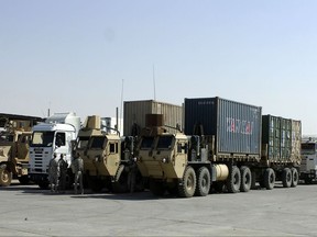 In this 2008 photo, a Convoy Security Element with Company A, 10th Brigade Support Battalion, 1st Brigade, 10th Mountain Division, aligns a re-supply convoy headed out of Forward Operating Base, Warrior, Kirkuk, Iraq. American military contractors operating in Iraq have accused Baghdad of using strong-arm tactics to force them to pay exorbitant taxes, a practice they've warned is undermining the mission to defeat the Islamic State extremists. To compel payment of the taxes, which can run into the millions of dollars, they say Iraqi authorities have held up the delivery of critical supplies, including food, fuel and water, bound for U.S.-led coalition forces combating the insurgents.(U.S. Army photo by Spc. Jason Jordan via AP)