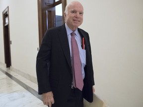 FILE - In this Sept. 5, 2017, file photo, Sen. John McCain, R-Ariz., walks from his Senate office as Congress returns from the August recess in Washington. The Senate is poised to pass a defense policy bill that pumps $700 billion into the Pentagon budget, expands U.S. missile defenses in response to North Korea's growing hostility and refuses to allow excess military bases to be closed. McCain has guided the bill toward passage over the last week as he railed against Washington gridlock and political gamesmanship.(AP Photo/J. Scott Applewhite, File)