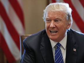 In this Sept. 12, 2017, photo, President Donald Trump speaks in the Cabinet Room of the White House in Washington. The Trump administration is poised to extend sanctions relief to Iran under the landmark 2015 nuclear deal even as the White House seeks ways to find the Islamic republic is not complying with the agreement. Administration officials say President Donald Trump is likely to extend sanctions waivers first issued by the Obama administration by a Sept. 14, deadline. However, they say Trump remains determined to "decertify" Iranian compliance by an October deadline.  (AP Photo/Alex Brandon)