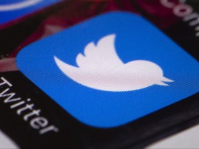 FILE- This April 26, 2017, file photo shows the Twitter app on a mobile phone in Philadelphia. Social media giant Twitter will visit Capitol Hill Sept. 28, as part of the House and Senate investigations into Russian interference in the 2016 elections.. (AP Photo/Matt Rourke, File)