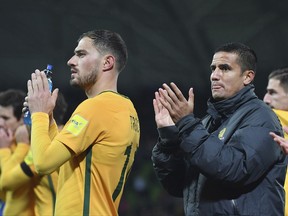 Australia's James Troisi, left and Tim Cahill thanks fans after their World Cup Group B qualifying soccer match against Thailand in Melbourne, Australia, Tuesday, Sept. 05, 2017. (AP Photo/Andy Brownbill)