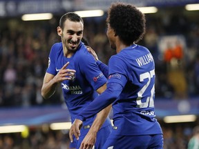 Chelsea's Davide Zappacosta, left, celebrates with his teammate Willian after scoring during the Champions League group C soccer match between Chelsea and Qarabag at Stamford Bridge stadium in London, Tuesday, Sept. 12, 2017. (AP Photo/Kirsty Wigglesworth)