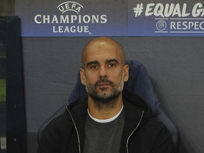 Manchester City head coach Pep Guardiola wait for the start of the game in the technical area ahead of the the Champions League Group F soccer match between Manchester City and Shakhtar Donetsk at Etihad stadium, Manchester, England, Tuesday, Sept. 26, 2017. (AP Photo/Rui Vieira)