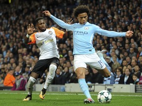 Manchester City's Leroy Sane, right attempts a shot on goal as Shakhtar's Fred goes to challenge during the Champions League Group F soccer match between Manchester City and Shakhtar Donetsk at Etihad stadium, Manchester, England, Tuesday, Sept. 26, 2017. (AP Photo/Rui Vieira)