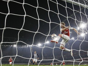 Arsenal's Nacho Monreal clears the ball off the line during their English Premier League soccer match between Arsenal and West Bromwich Albion at the Emirates stadium in London, Monday, Sept. 25, 2017. (AP Photo/Alastair Grant)
