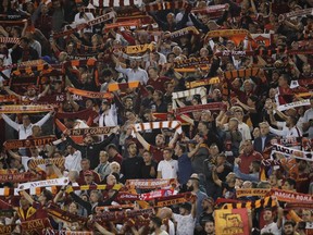Roma fans chant at the start of a Champions League, Group C match, between Roma and Atletico Madrid, at the Olympic stadium in Rome, Tuesday, Sept. 12, 2017. (AP Photo/Alessandra Tarantino)