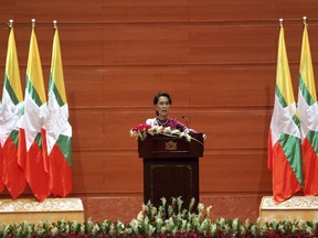 Myanmar's State Counsellor Aung San Suu Kyi delivers a televised speech to the nation at the Myanmar International Convention Centre in Naypyitaw, Myanmar, Tuesday, Sept 19, 2017. Myanmar leader Suu Kyi is defending her country against international criticism over a mass exodus of Rohingya Muslims by saying most of their villages remain intact, and that it's important to understand why conflict did not break out everywhere. (AP Photo/Aung Shine Oo)