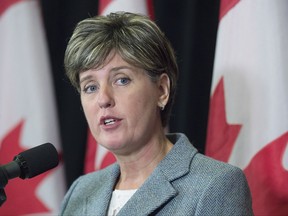 International Development Minister Marie-Claude Bibeau talks with reporters before the morning session as the Liberal cabinet meets in St. John's, N.L. on Tuesday, Sept. 12, 2017. THE CANADIAN PRESS/Andrew Vaughan