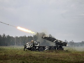 In this Sunday, Sept. 17, 2017 photo provided by Vayar Military Agency, Belarus army air defence missile system fires on the position during a military exercise at a training ground at an undisclosed location in Belarus.