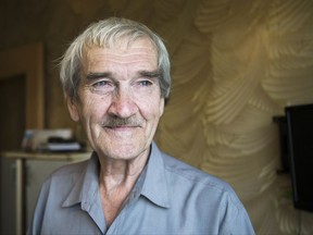 FILE In this file photo taken on Thursday, Aug. 27, 2015, former Soviet missile defense forces officer Stanislav Petrov poses for a photo at his home in Fryazino, Moscow region, Russia. Petrov, a former Soviet military officer known in the West as "The man who saved the world'' for his role in averting a nuclear war over a false missile alarm, died in May at age 77. (AP Photo/Pavel Golovkin)