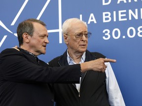 Director David Batty, left, and actor Michael Caine pose for photographers during the photo call of the film 'My Generation', at the 74th edition of the Venice Film Festival, in Venice, Italy, Tuesday, Sept. 5, 2017. (AP Photo/Domenico Stinellis)