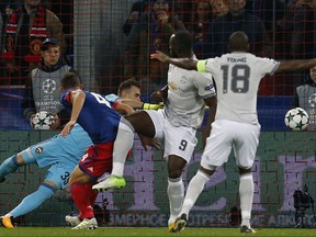 Manchester United's Romelu Lukaku, center, scores his side's opening goal during the group A Champions League soccer match between CSKA Moscow and Manchester United in Moscow, Russia, Wednesday, Sept. 27, 2017. (AP Photo/Alexander Zemlianichenko)