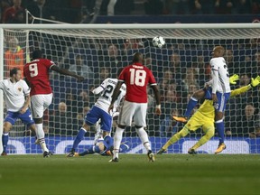 Manchester United's Romelu Lukaku, left, fails to score during the Champions League group A soccer match between Manchester United and Basel, at the Old Trafford stadium in Manchester, Tuesday, Sept. 12, 2017. (AP Photo/Frank Augstein)