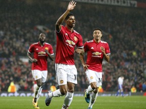 Manchester United's Marcus Rashford, center, celebrates his goal during the Champions League group A soccer match between Manchester United and Basel, at the Old Trafford stadium in Manchester, Tuesday, Sept. 12, 2017. (AP Photo/Frank Augstein)