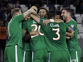 Republic of Ireland's players celebrates after scoring a goal during the World Cup Group D qualifying soccer match between Georgia and Republic of Ireland at the Boris Paichadze Dinamo Arena in Tbilisi, Georgia, Saturday, Sept. 2, 2017. (AP Photo/Shakh Aivazov)