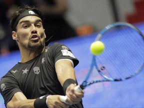 Fabio Fognini of Italy returns the ball to Damir Dzumhur of Bosnia and Herzegovina during the St. Petersburg Open ATP tennis tournament final match in St.Petersburg, Russia, Sunday, Sept. 24, 2017. (AP Photo/Dmitri Lovetsky)