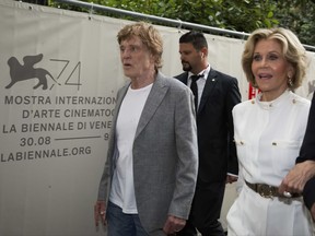 Actors Robert Redford and Jane Fonda arrive for the press conference for the movie "Our Souls At Night" at the 74th Venice Film Festival in Venice, Italy, Friday, Sept. 1, 2017. (AP Photo/Domenico Stinellis)