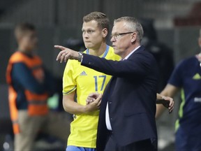 Sweden'd head coach Jan Andersson, right, gives instructions to his player Viktor Claesson during the World Cup Group A qualifying soccer match between Belarus and Sweden at the Borisov-Arena stadium, in Borisov, Belarus, Sunday, Sept. 3, 2017. (AP Photo/Sergei Grits)