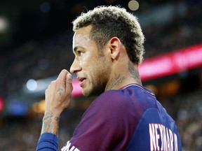 Paris Saint Germain's Neymar looks on during their French League One soccer match between PSG and Olympique Lyon at the Parc des Princes stadium in Paris, France, Sunday, Sept. 17, 2016. (AP Photo/Francois Mori)