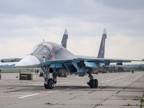 In this photo taken on Tuesday, Sept. 12, 2017, A Russian military jet is parked at an airbase at an undisclosed location in Belarus. Russia and Belarus are holding a massive war games, Zapad 2017, that due to start on Thursday near the borders of Poland, Estonia, Latvia and Lithuania. (Vayar Military Agency photo via AP)