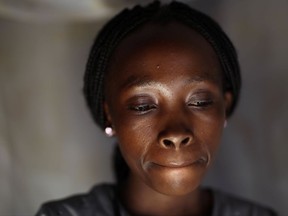 In this photo taken on Aug. 10, 2016, Bora, 22, poses for a portrait in the Congo Ituri province capital Bunia. Bora said she was just 11 when she became pregnant by her rapist, a U.N. peacekeeper. Two years later, she was a 13-year-old mother when another peacekeeper took advantage of her. She once again became pregnant. (AP Photo/Jerome Delay)