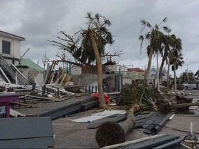 Damaged buildings and fallen trees litter downtown Marigot, on the island of St. Martin, after the passing of Hurricane Irma, Saturday, Sept. 9, 2017.  On the Dutch side of St. Martin, an island divided between French and Dutch control, an estimated 70 percent of the homes were destroyed by Irma, according to the Dutch government. The island is divided between French Saint-Martin and Dutch Sint Maarten. (AP Photo/Amandine Ascensio)
